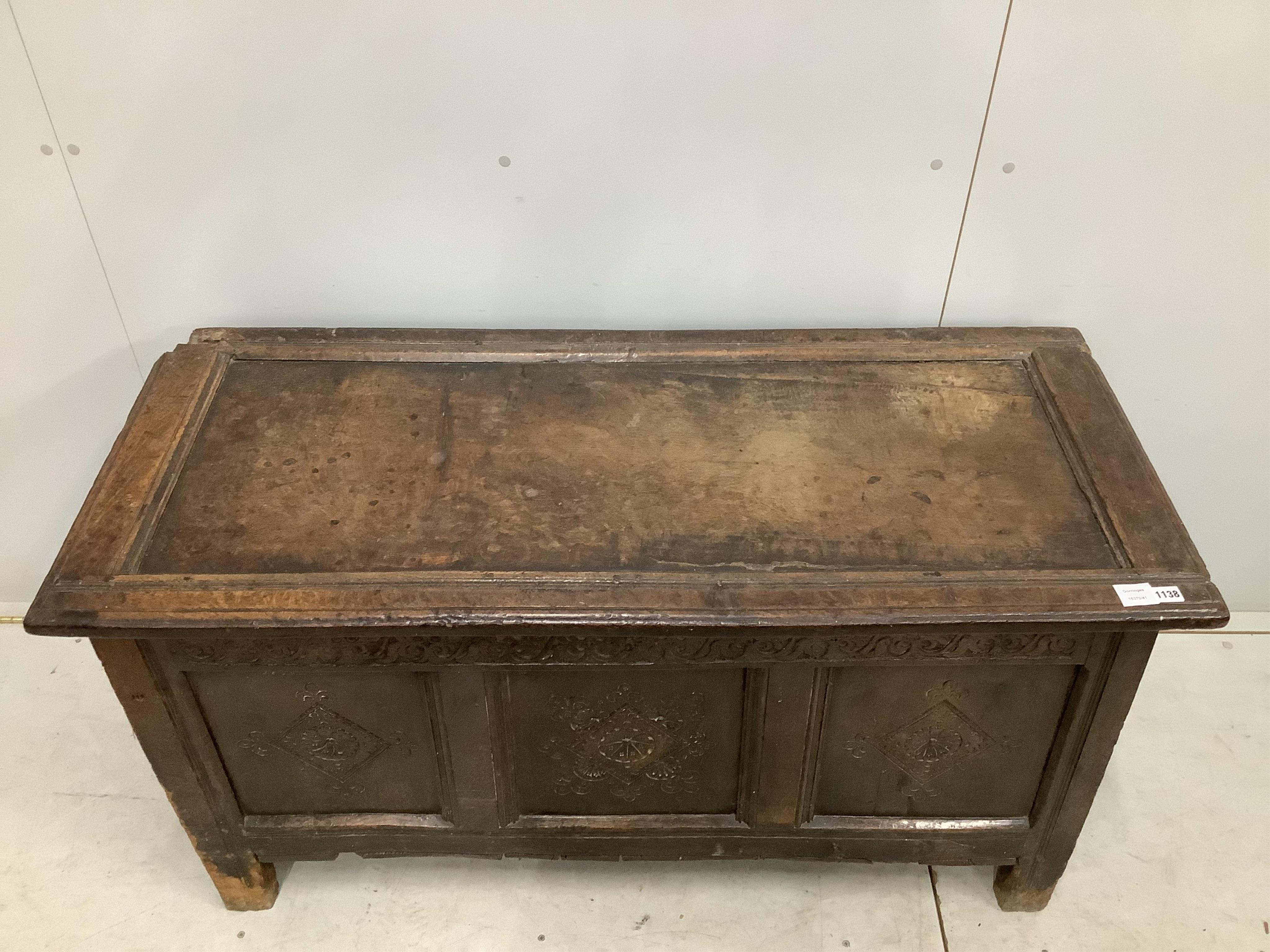 A late 17th century carved oak coffer, width 128cm, depth 56cm, height 66cm. Condition - poor